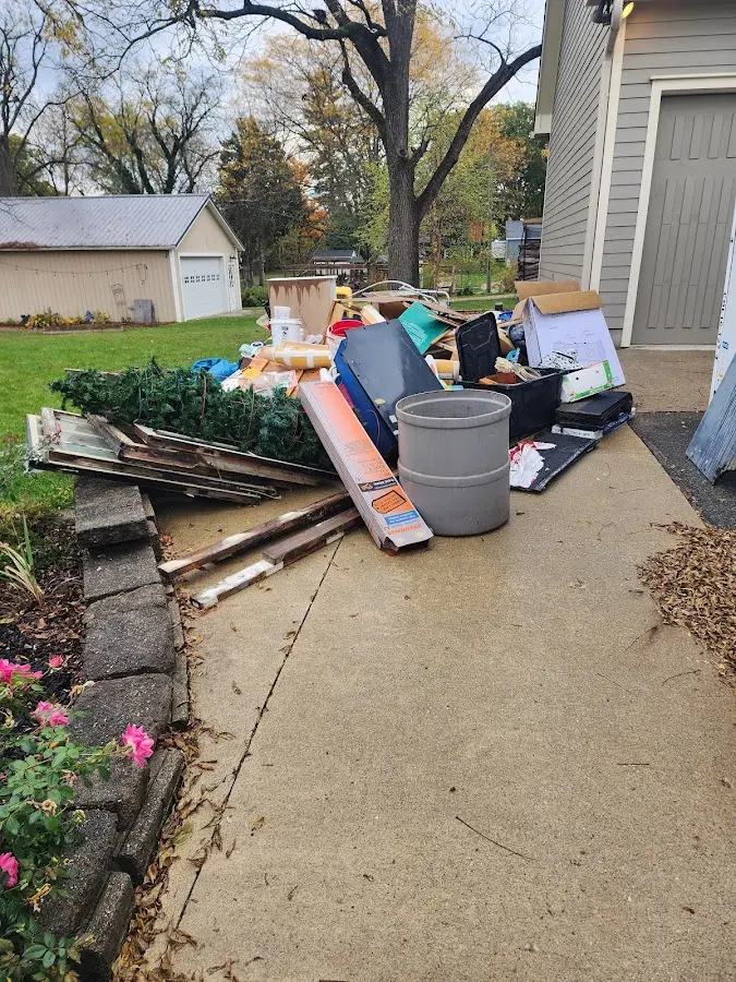 Dumpster being loaded with debris for Residential Dumpster Rental in Mount Vernon